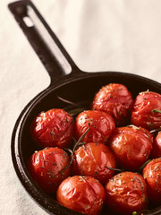 Grilled cherry tomatoes and cast iron pot