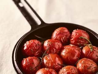 Grilled cherry tomatoes and cast iron pot
