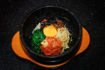 Rice with vegetable in hot bowl Korean food