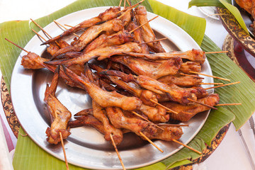 baked fried chicken wings carcass on metal Plate