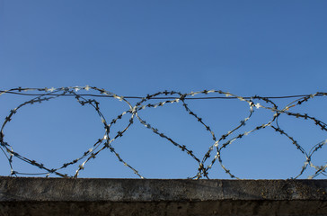 A fence with barbed wire.