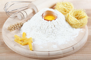Baking ingredients for cooking on a wooden table.
