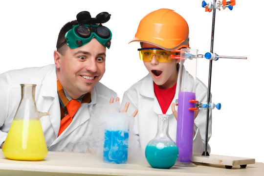 Teen and teacher of chemistry at  lesson making experiments