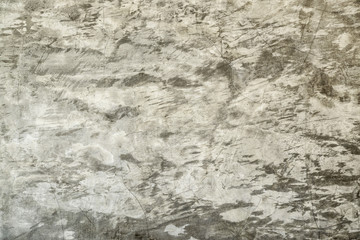 Old concrete wall and cement embedded cracks.