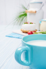 mug with milk on vintage table