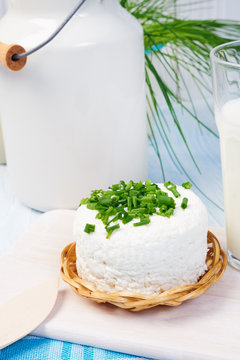 Chives, milk jug and cottage chease