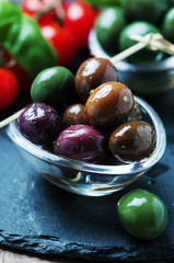 Green olives on the black table