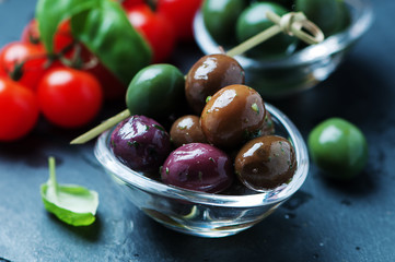 Green olives on the black table