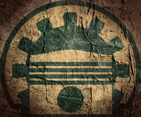 gear and piston on grunge textured backdrop
