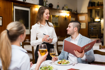 Man with girlfriend in cafe