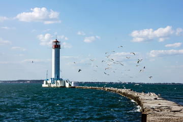 Old Vorontsov lighthouse in Odessa harbor, Ukraine. - obrazy, fototapety, plakaty