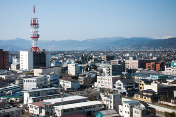 Japan cityscape in the morning with a tall antenna