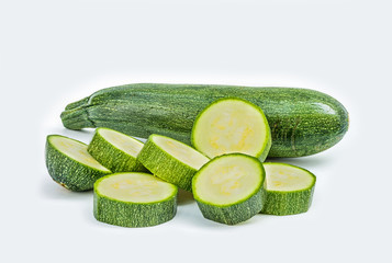 Fresh healthy green zucchini isolated on white background .