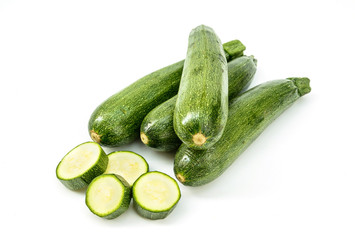 Fresh healthy green zucchini isolated on white background .