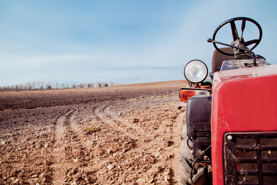 Little Tractor A Field In The Spring 