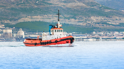 Red Tugboat on a sea