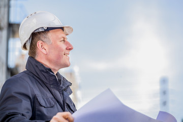 Construction manager with blueprints