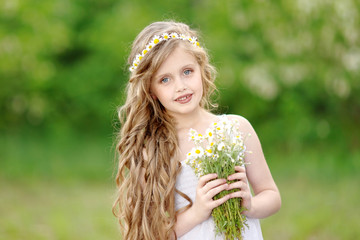 portrait of little girl outdoors in summer