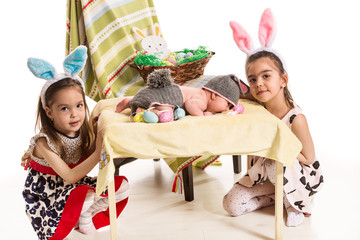 Fototapeta premium Three sisters with Easter bunny ears