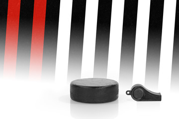Hockey puck and referee whistle