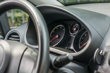 Obraz na płótnie Canvas Steering wheel and dashboard