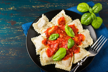 Ravioli with tomato sauce and basil