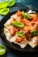 Ravioli with tomato sauce and basil