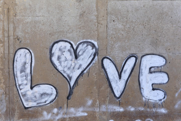 inscription love on a concrete wall