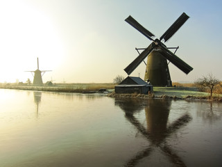 Fototapeta na wymiar Traditional Dutch windmills at dawn in Kinderdijk, Netherlands