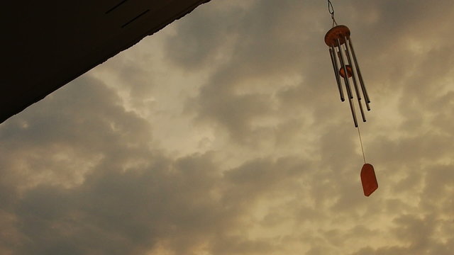 wind chime tube mobile in breeze.