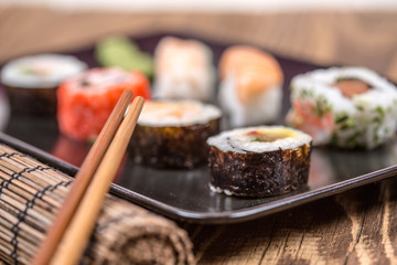 Fresh platter of bean sprouts with chopsticks on wooden table