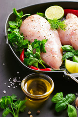 Fresh raw chicken breast,  spices and herbs