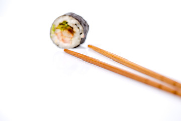 Sushi pieces collection with bamboo chopsticks, isolated on white