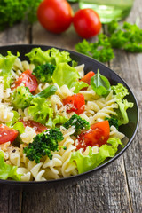Pasta salad with cherry tomatoes and broccoli