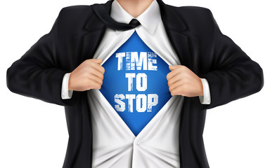 businessman showing Time to stop words underneath his shirt