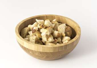 Wooden cup with roasted bread rusks