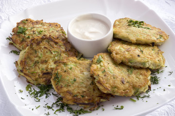 The zucchini pancakes with sour cream.