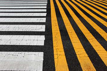 yellow and white lines on asphalt