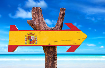 Spain Flag wooden sign with beach background
