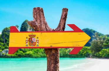 Spain Flag wooden sign with beach background