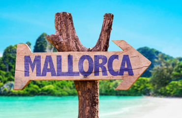 Mallorca wooden sign with beach background