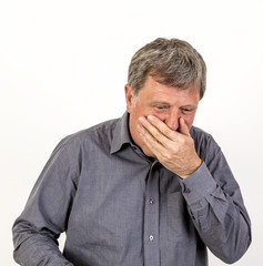 coffin mature man with grey polo shirt