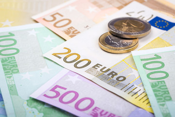 Closeup of euro banknotes and coins