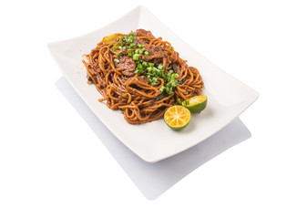 Popular Malaysian stir fried noodles on white plate