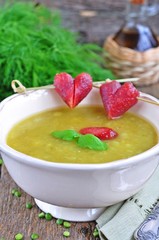 Appetizing pea soup with bacon and sausage