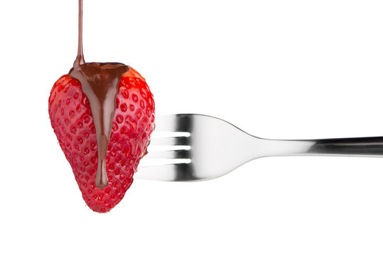 Strawberry and chocolate on a fork