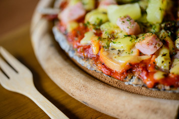 pizza Hawaiian thin crust pizza.