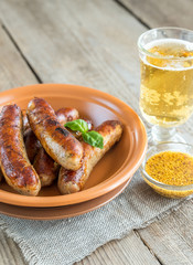 Grilled sausages with glass of beer