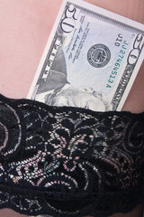 Dollars in woman stocking