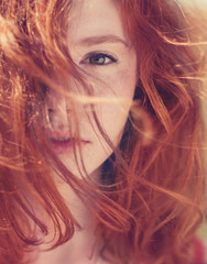 Portrait of red-haired girl close-up